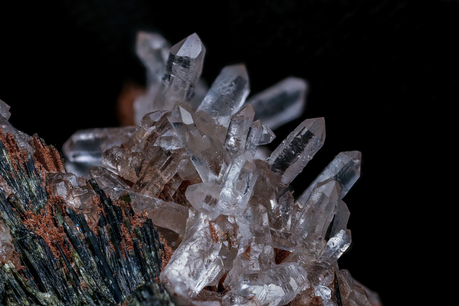A rough-cut gemstone catching light against a dark background