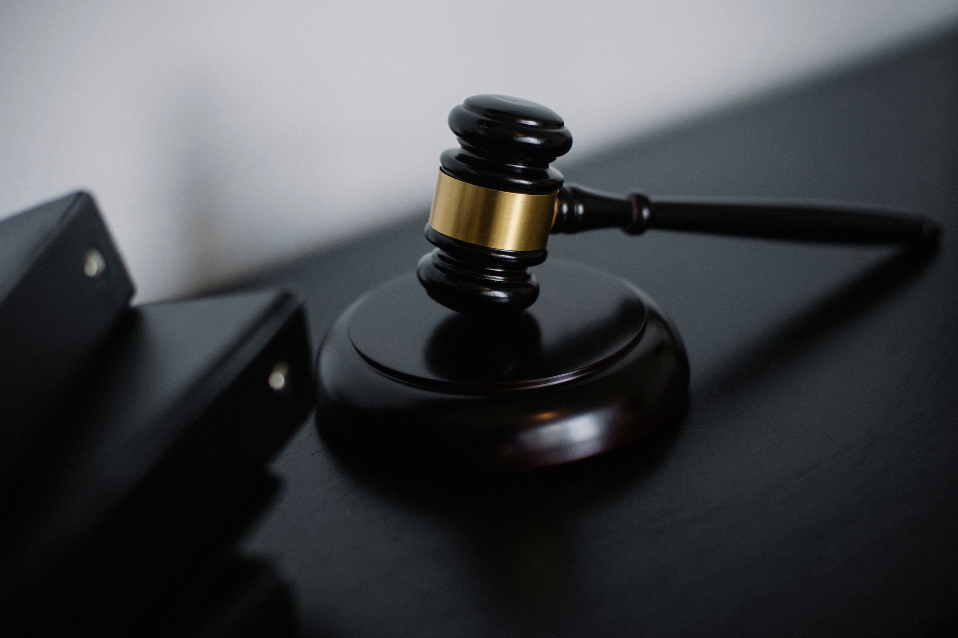 An auction gavel beside a laptop
