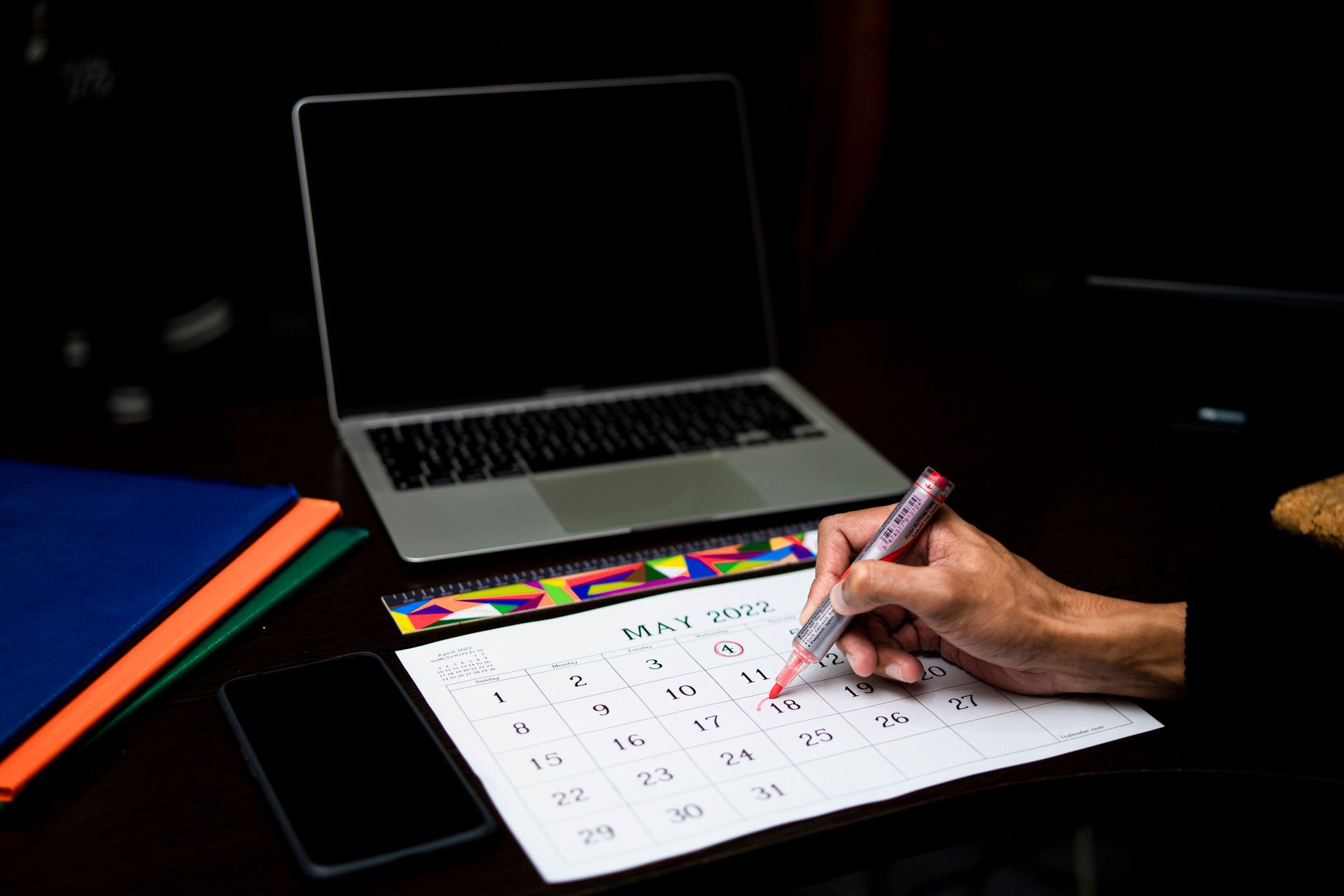 A desk calendar with dates marked