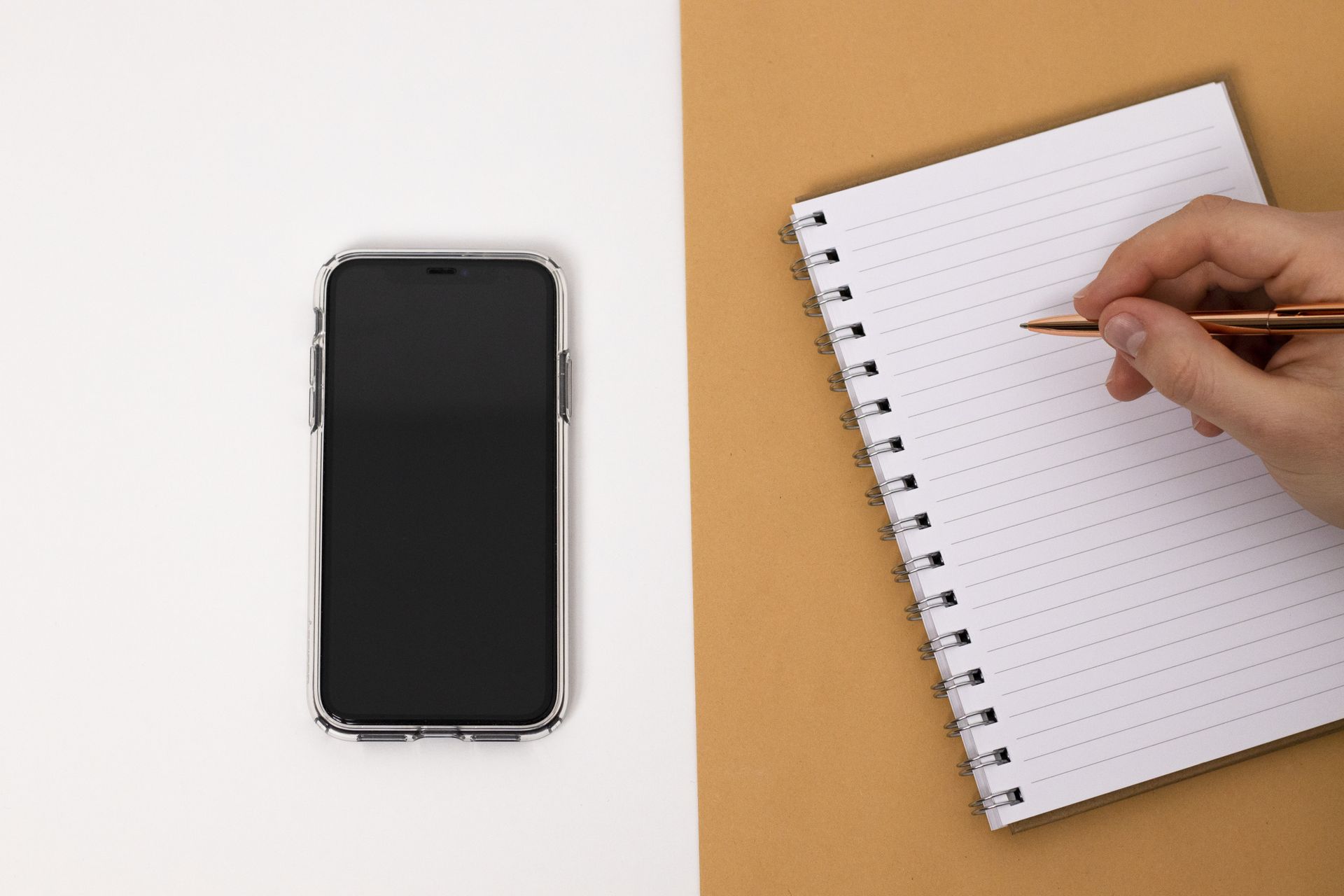 A two-column comparison written in a notebook
