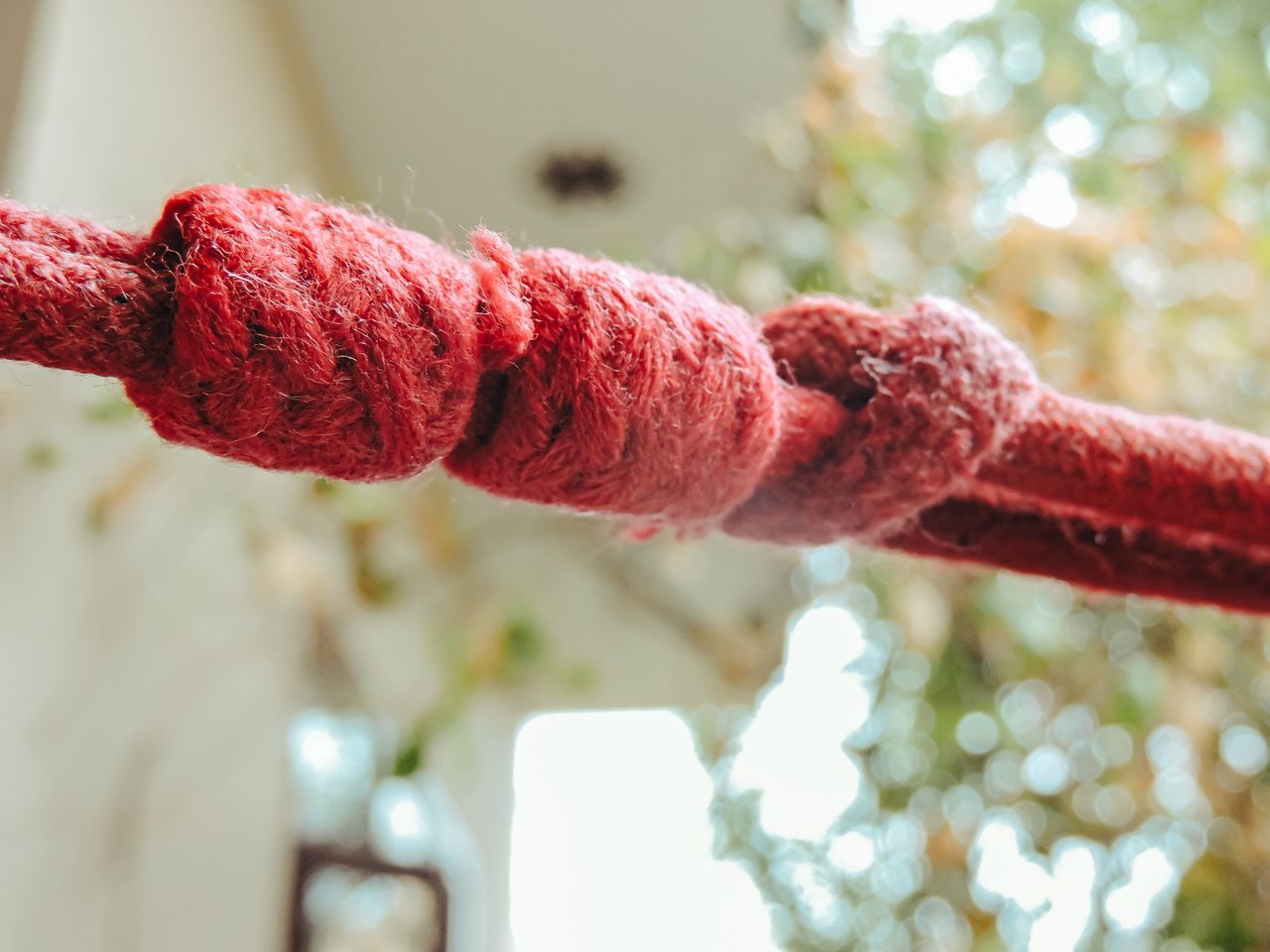 A climbing rope tied into a knot, photographed close