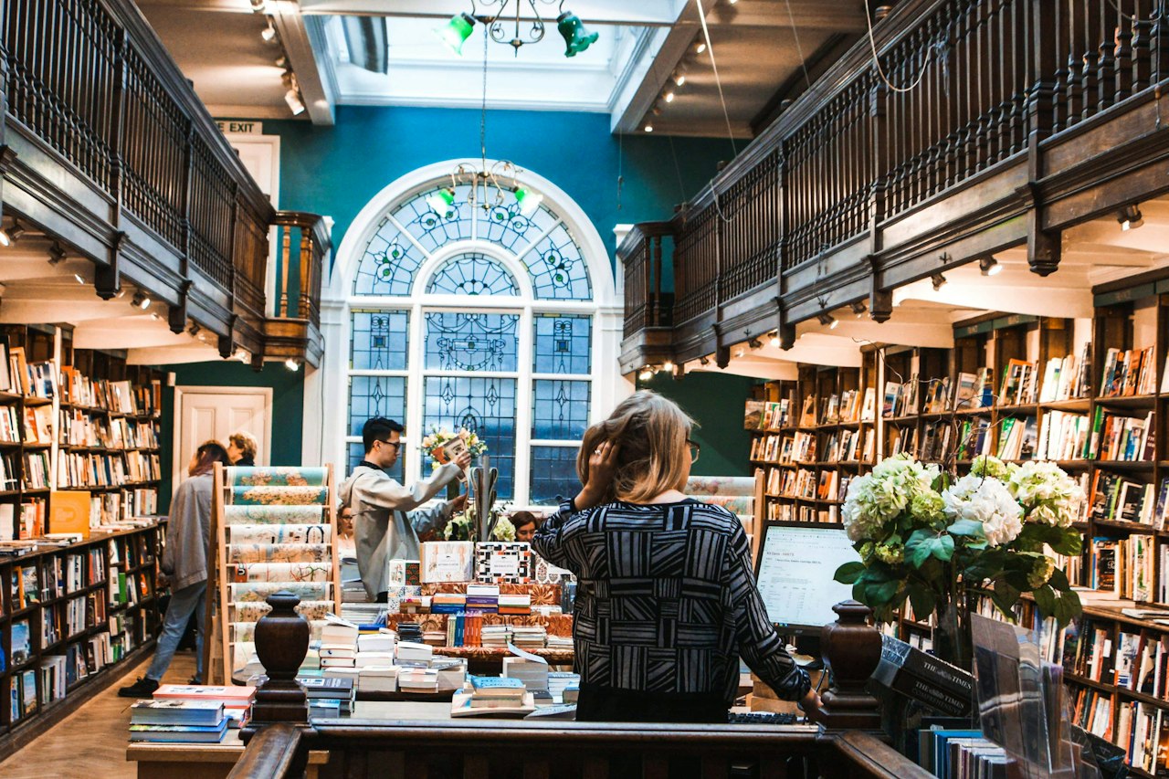 Readers browsing shelves inside a bookshop