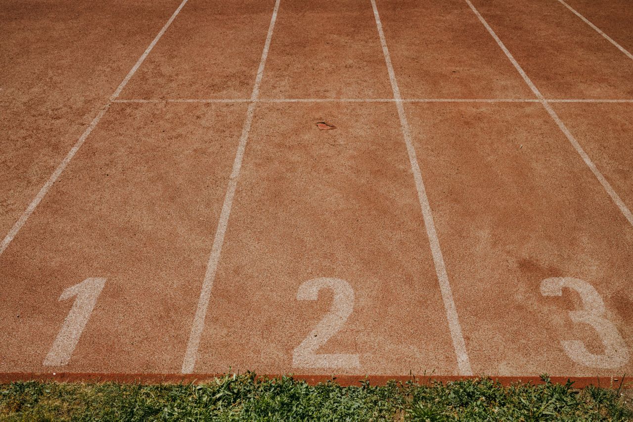 The painted finish line of an athletics track