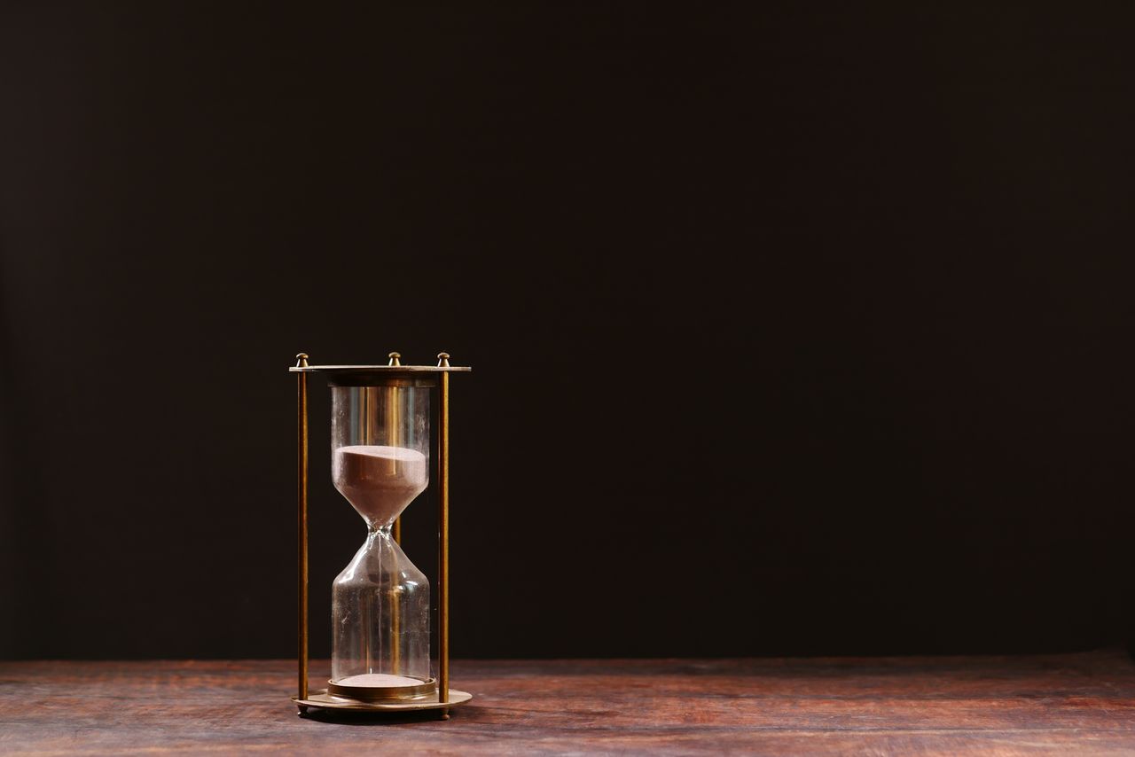 An hourglass with sand running through it