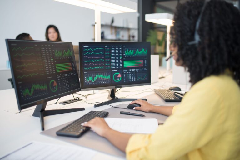 Two different dashboards shown on adjacent screens