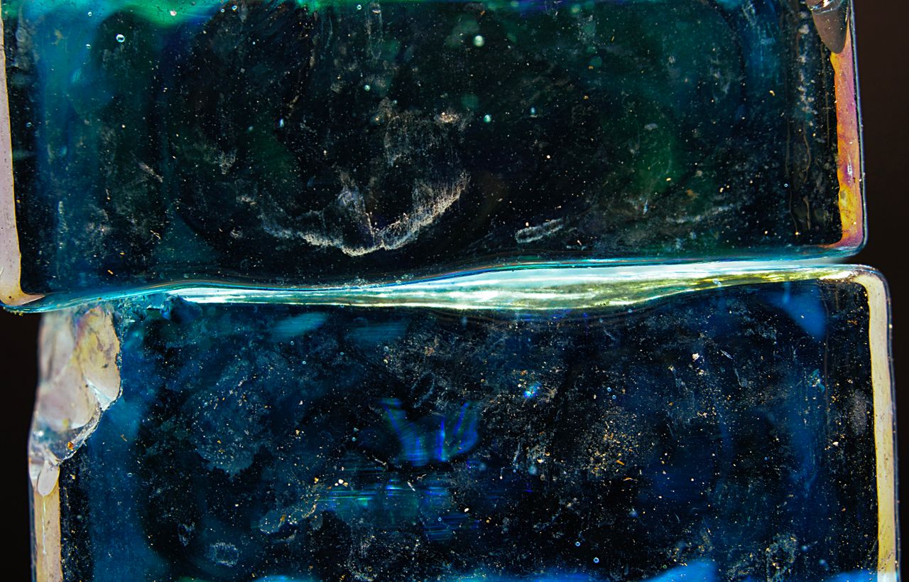 Layers of translucent glass stacked one behind another