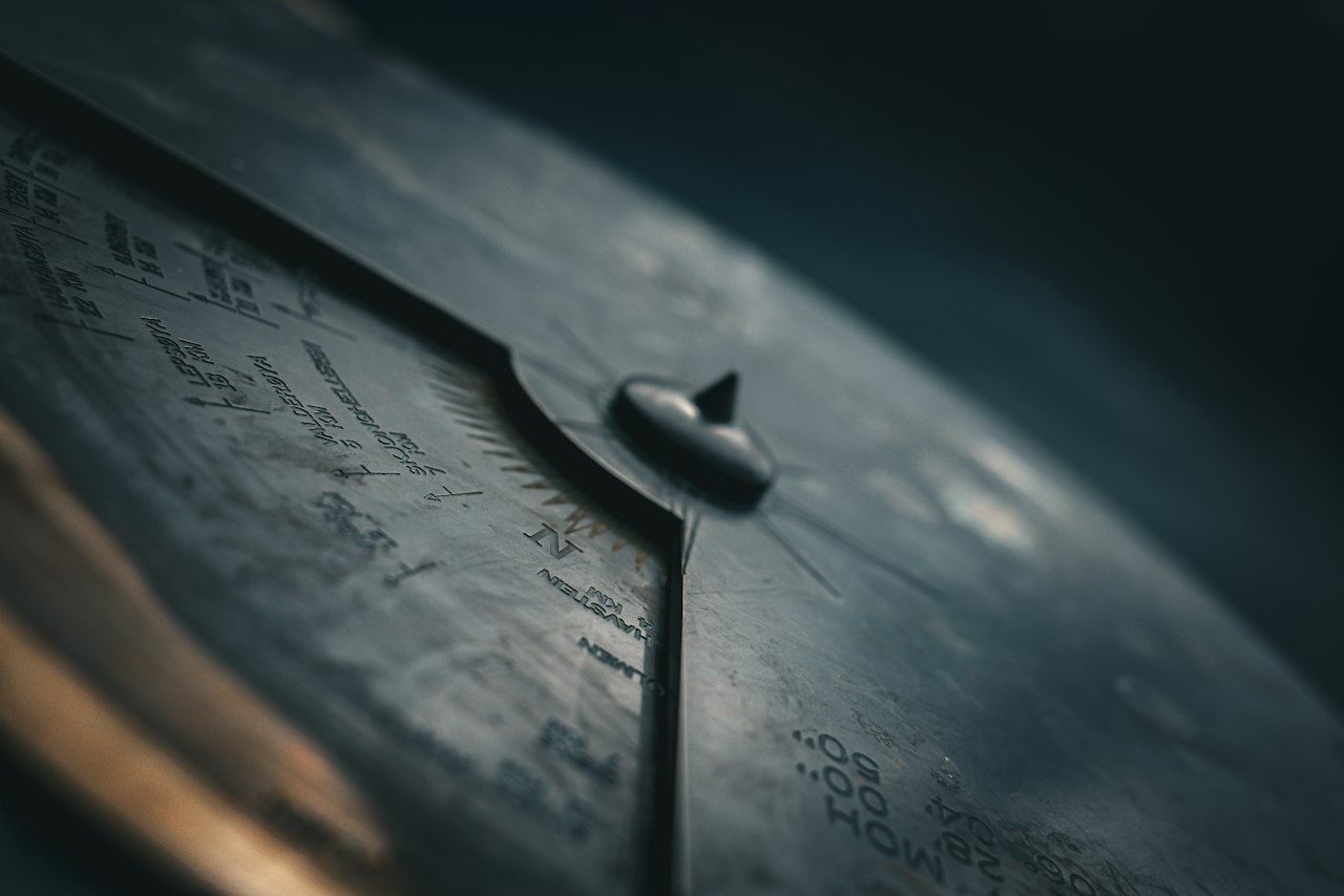 The needle of a compass in close focus
