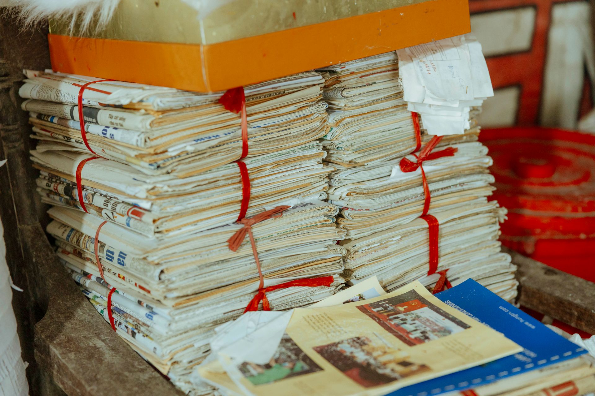 A stack of dated newspapers