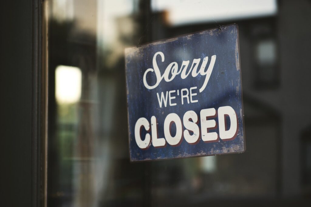 A closed door with a sign