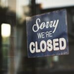 A closed door with a sign