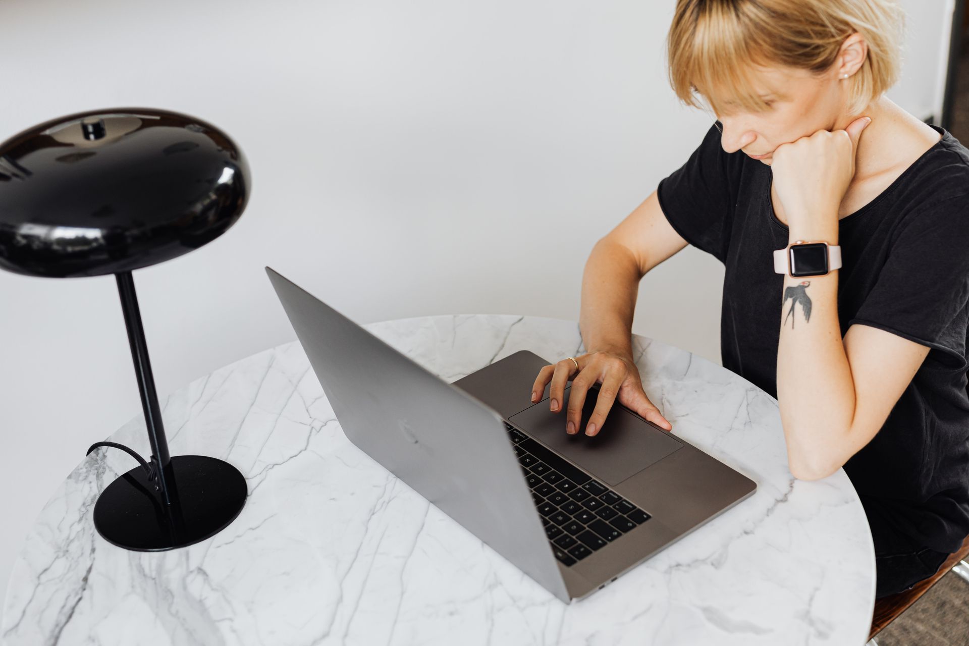 A blogger waiting at a laptop
