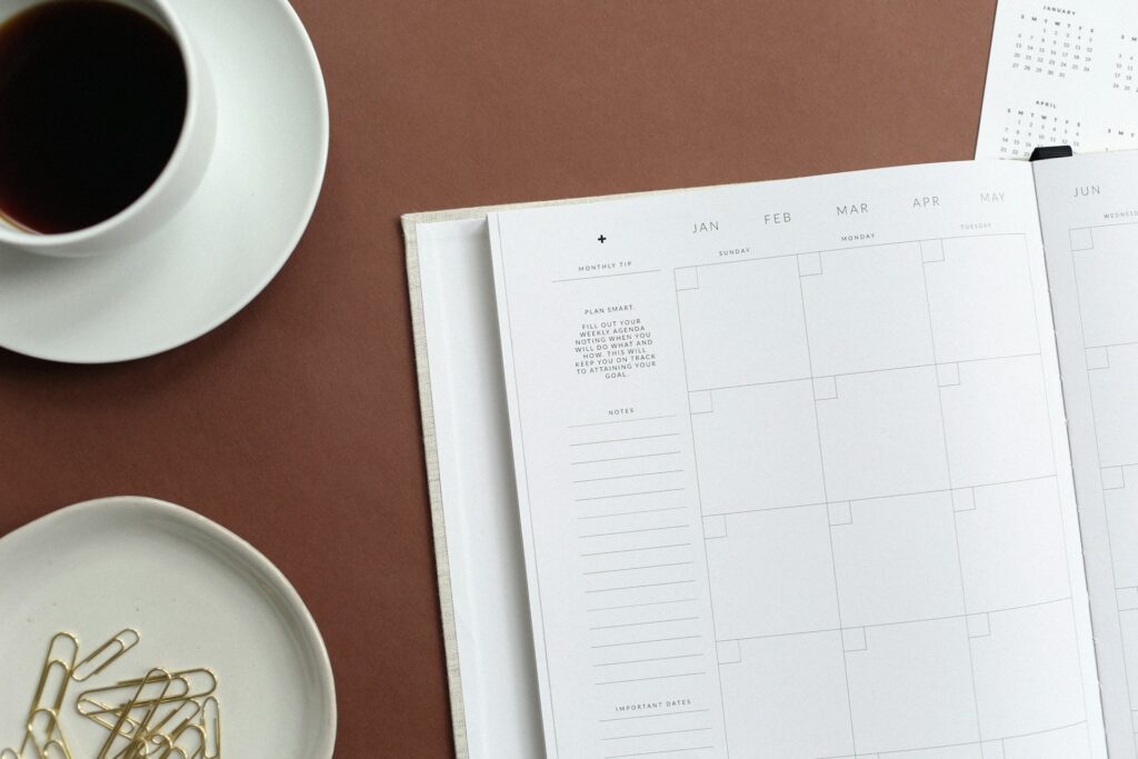 A calendar and coffee on a desk