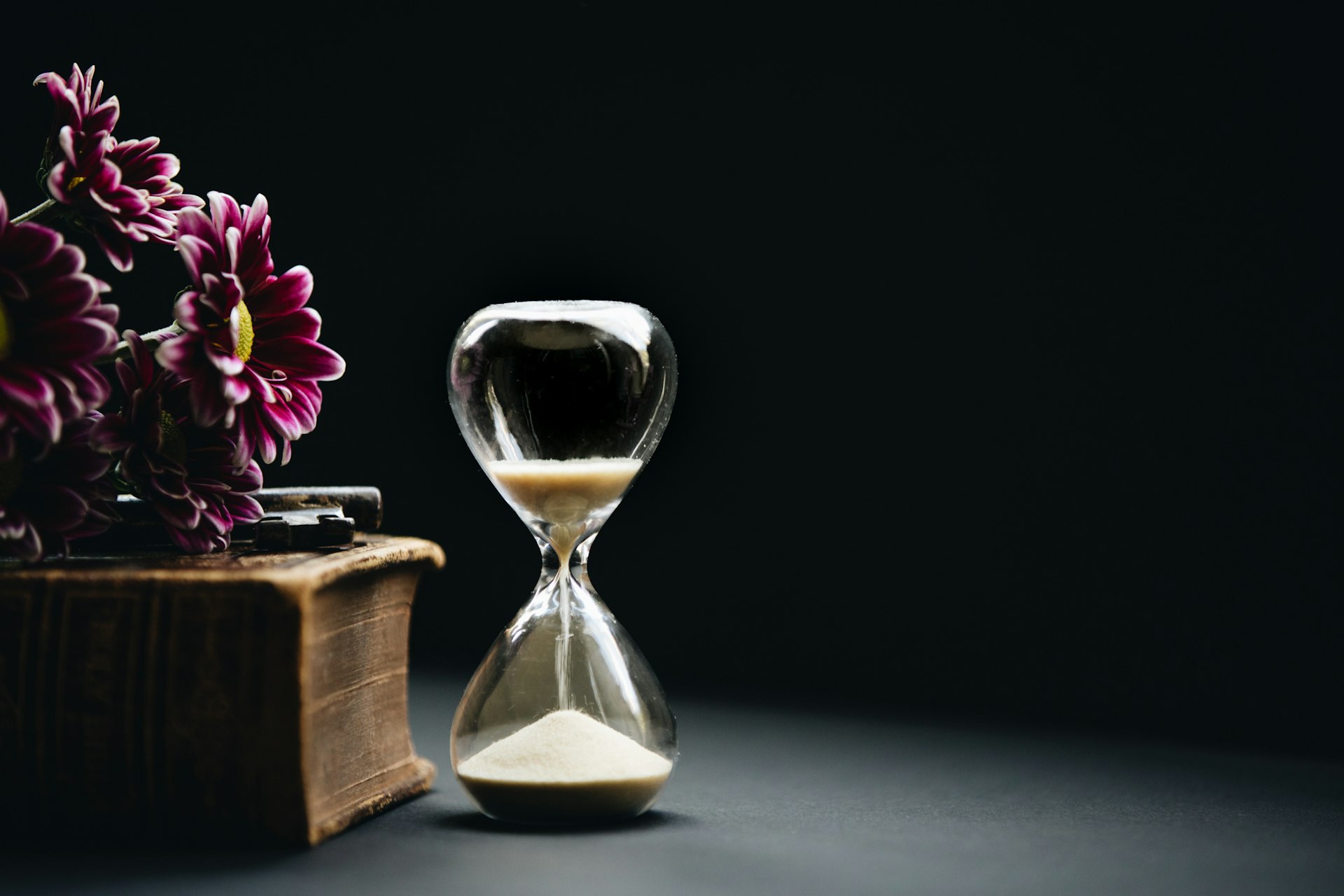 An hourglass on a desk