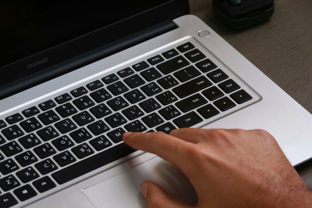 A blogger filling in an ad network application on a laptop