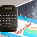 A calculator beside an affiliate report