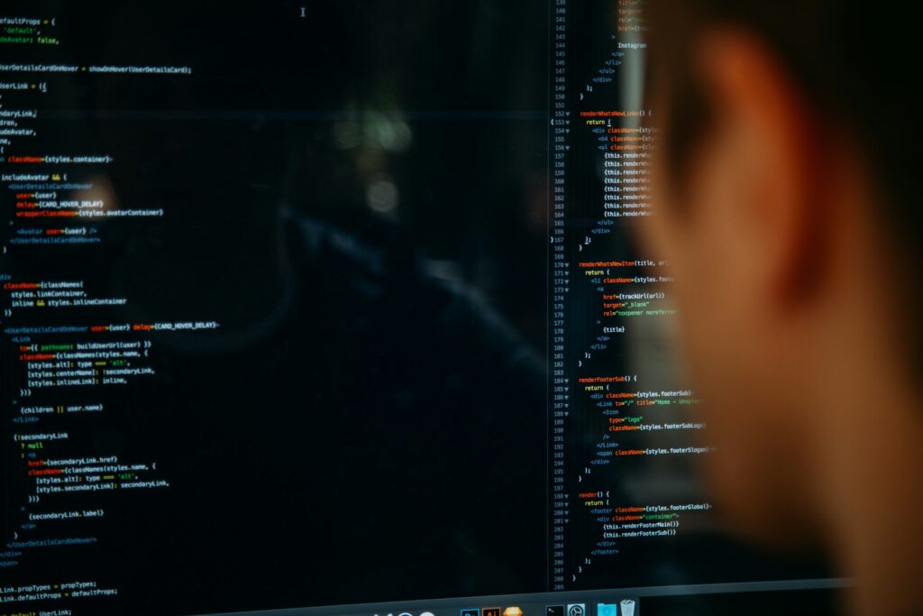 A developer coding a website at night