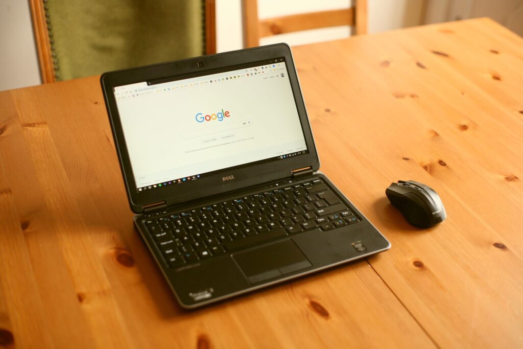 A laptop showing a search engine homepage