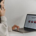A software comparison page on a laptop