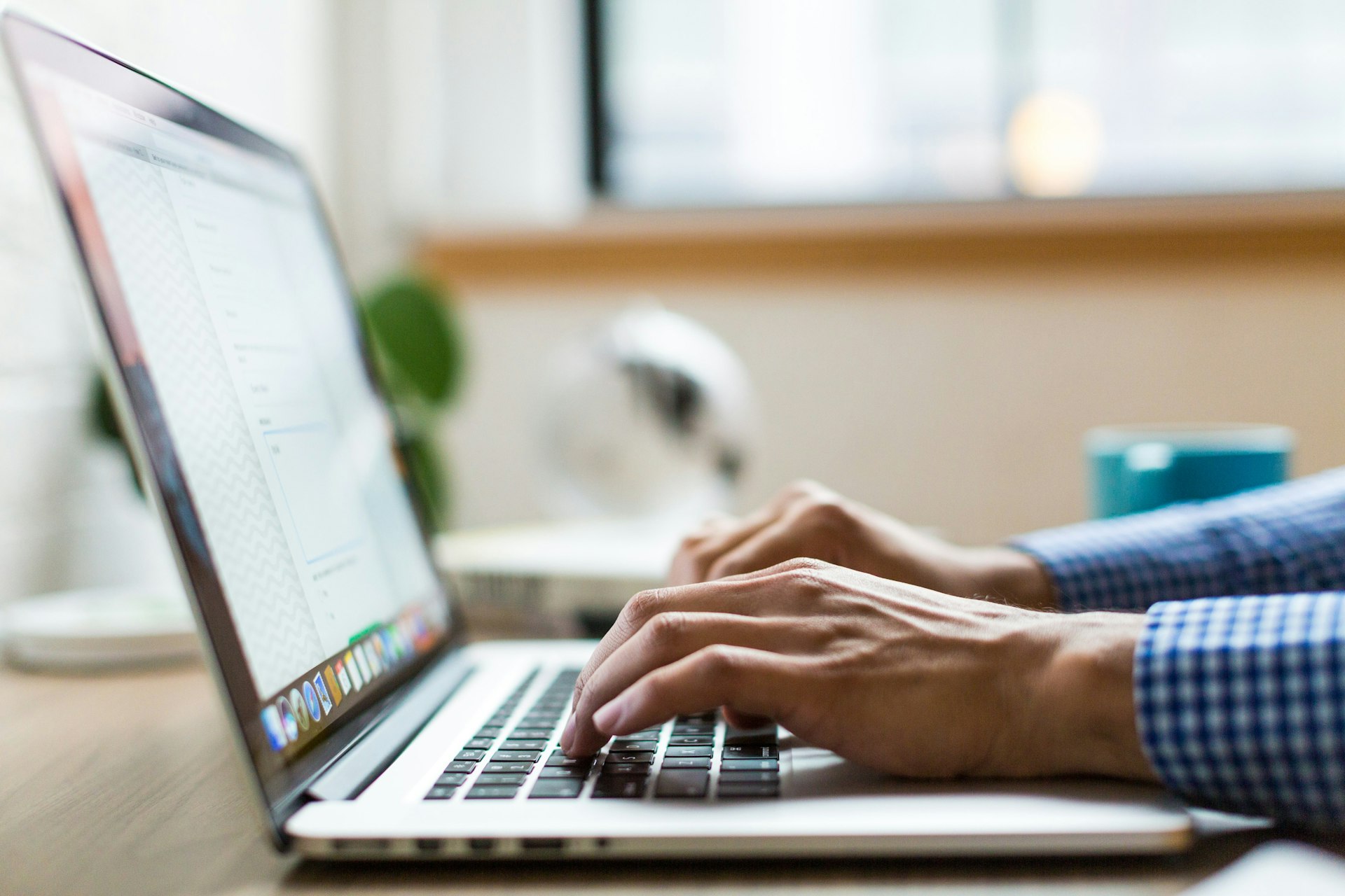 An outreach email draft on a laptop