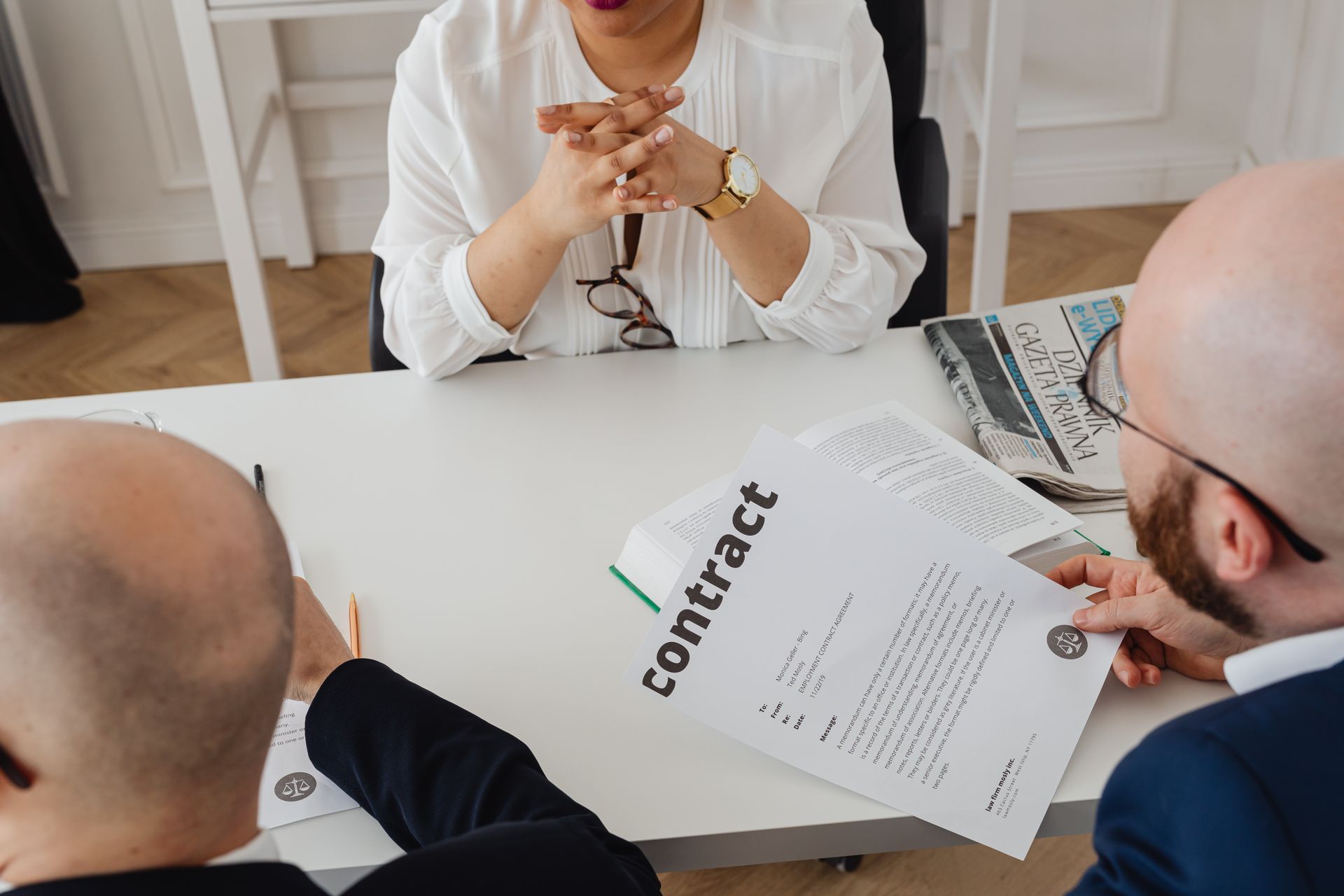 A team reviewing contracts