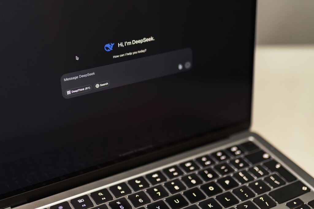 A person using an AI chat on a laptop