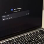 A person using an AI chat on a laptop
