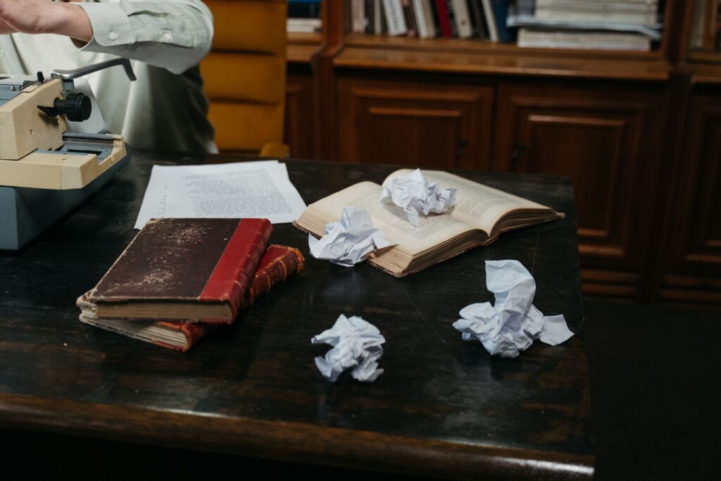 A writer reading a brief at a desk