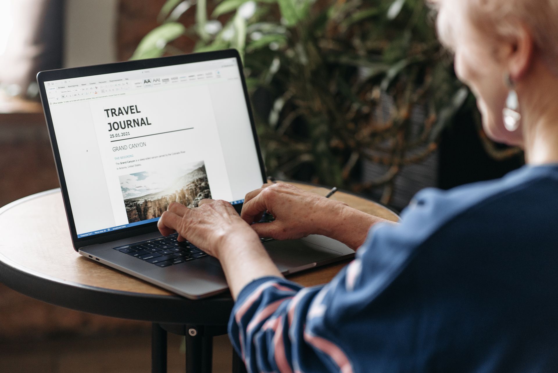 An editor updating an outdated article on a laptop