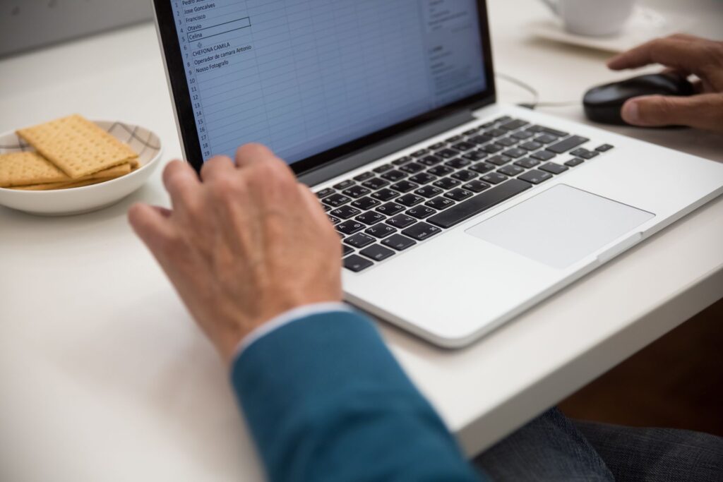 A content audit spreadsheet open on a laptop