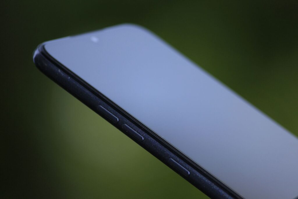 A finger tapping the wrong button on a phone