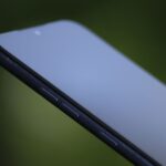 A finger tapping the wrong button on a phone
