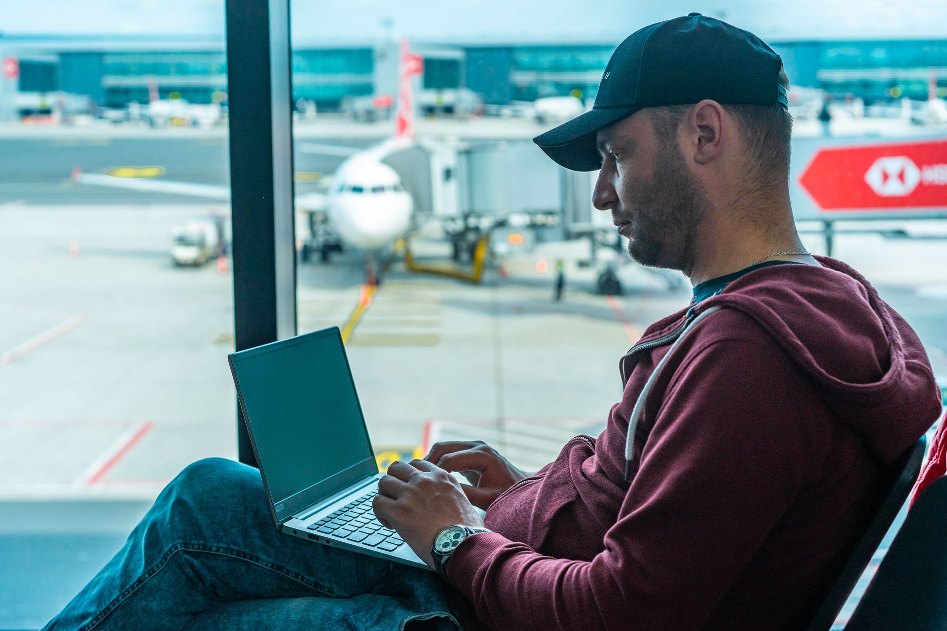 A person waiting at a laptop