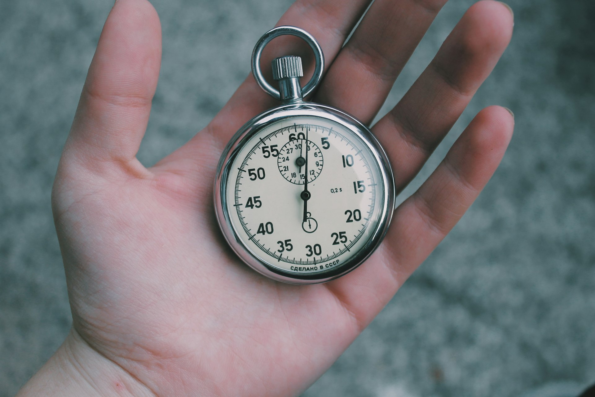 A stopwatch in a hand