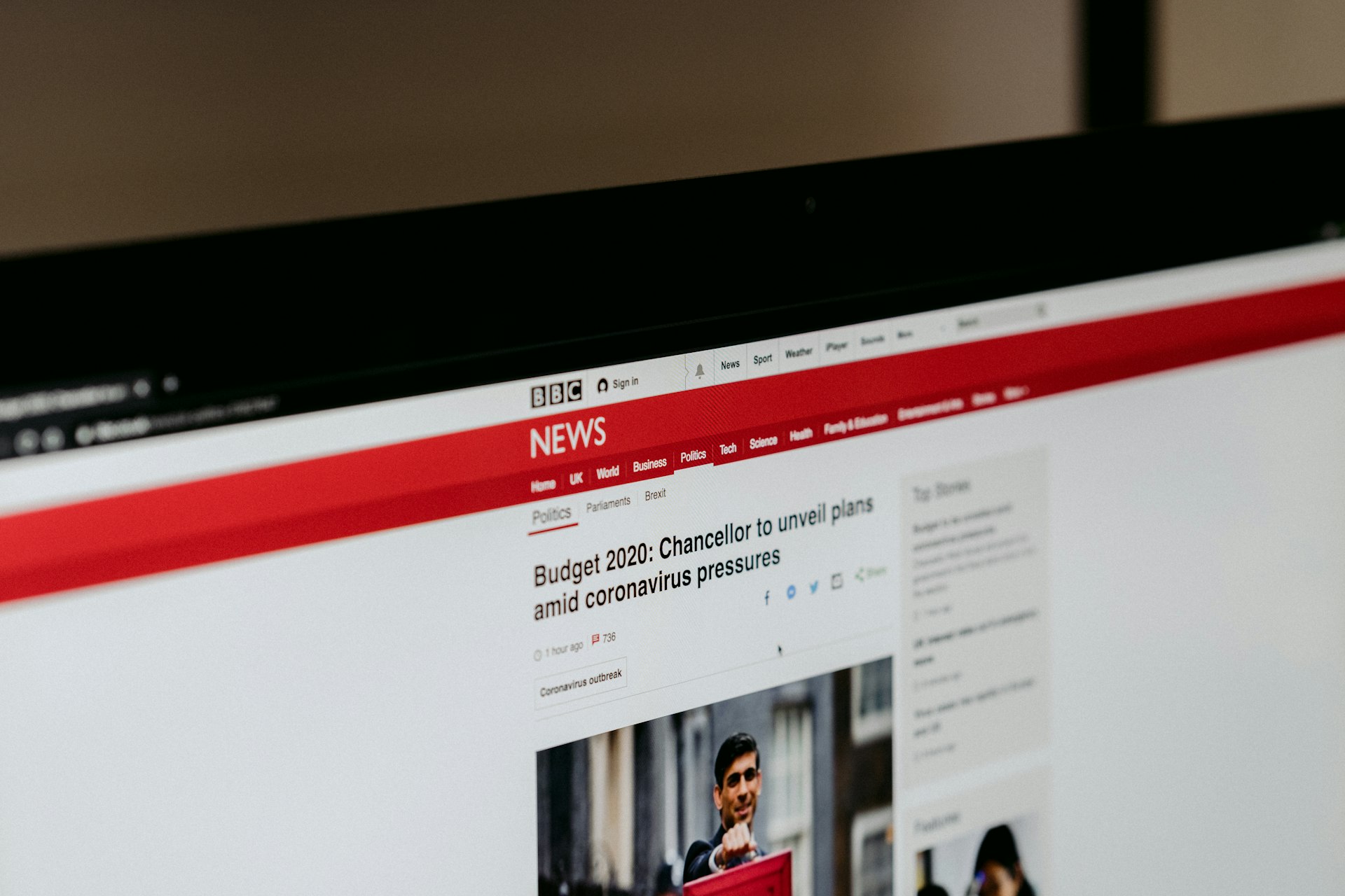 A news publisher homepage on a monitor