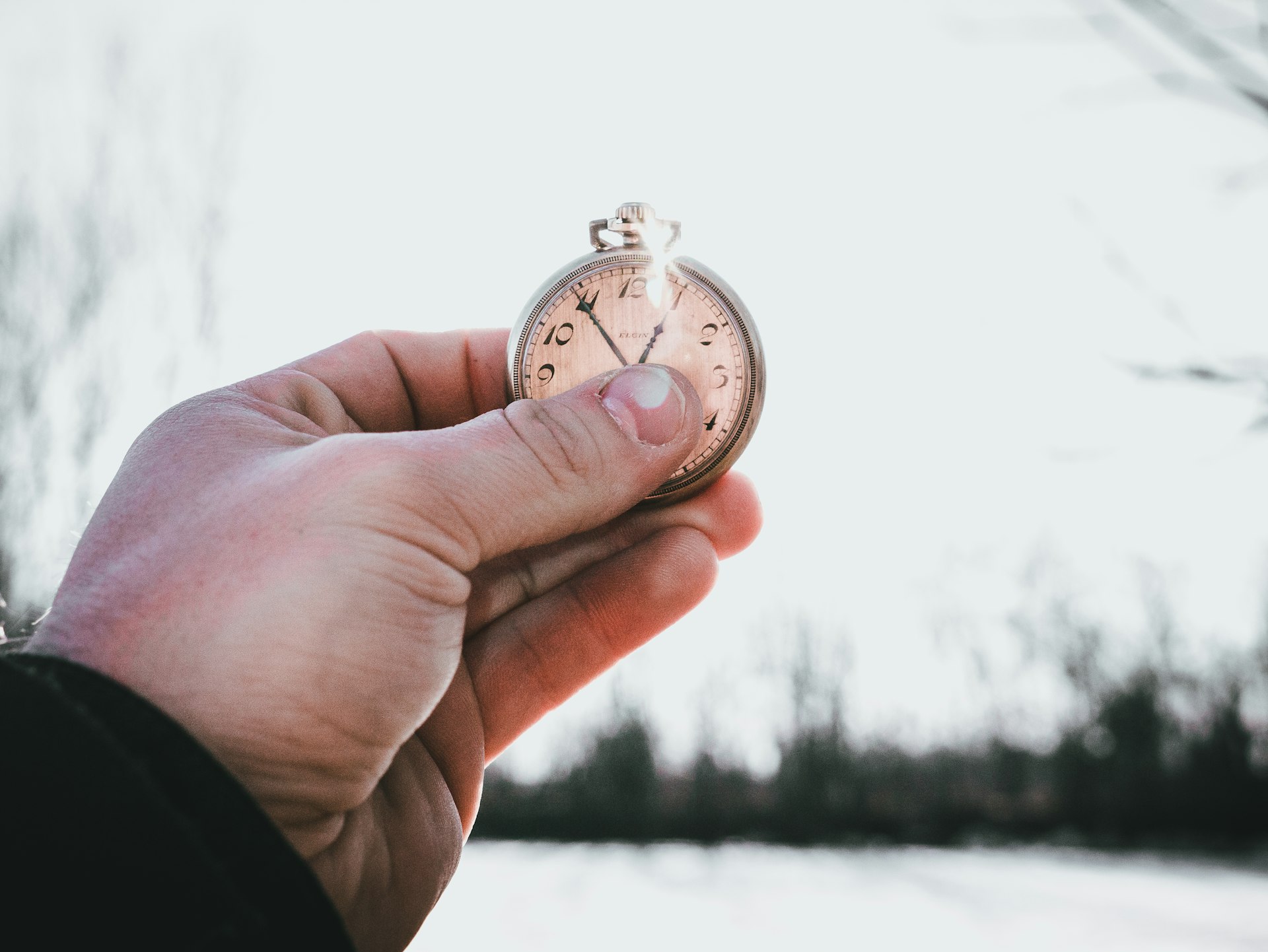 A stopwatch held in a hand