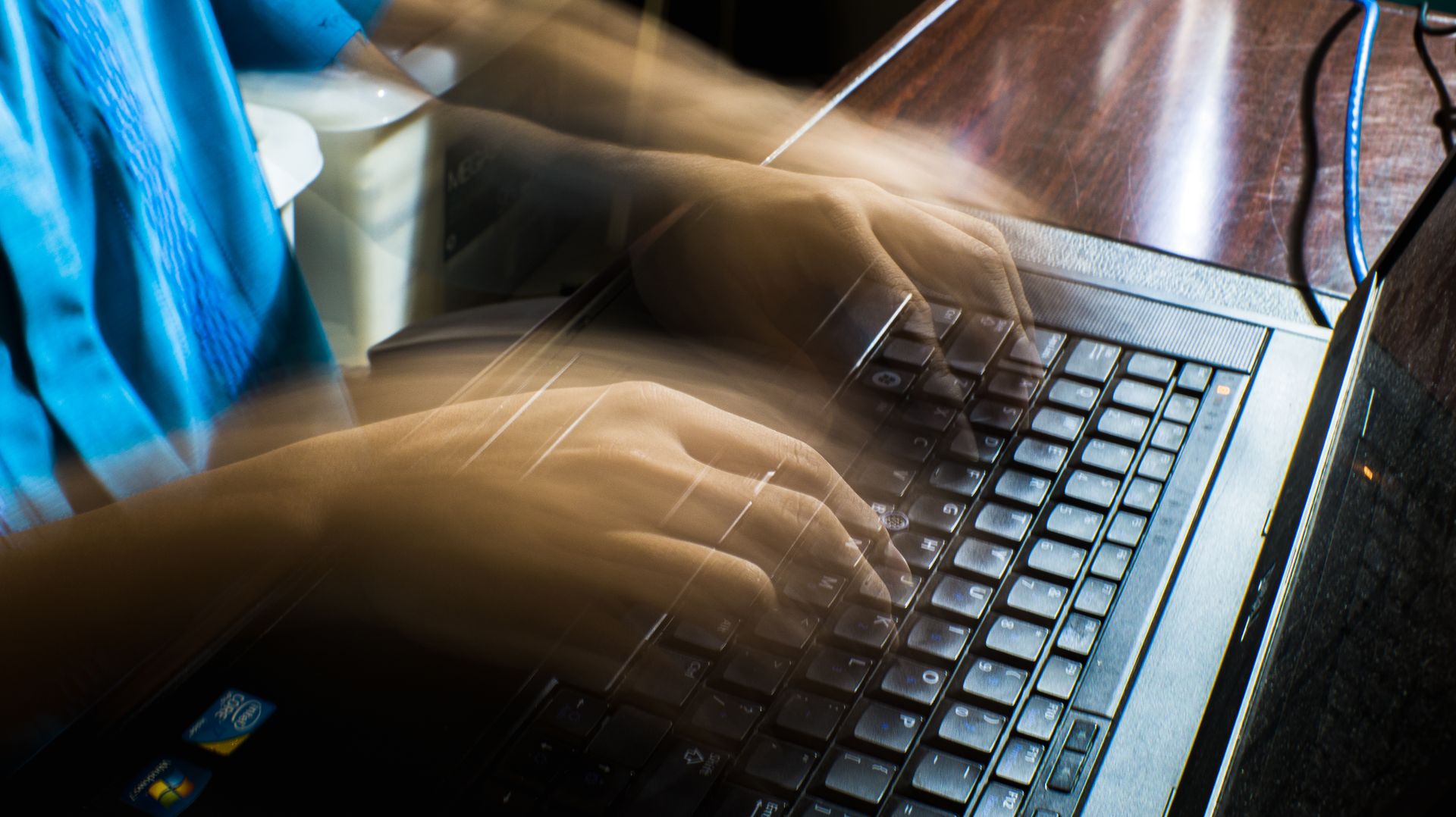 A person typing on a keyboard