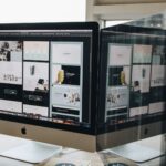 Two near-identical web pages on side-by-side monitors