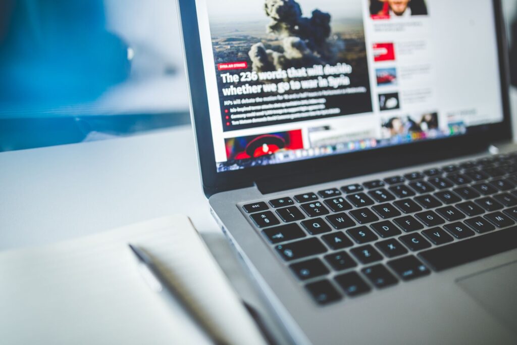 An author bio box at the end of an article on a laptop
