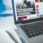 An author bio box at the end of an article on a laptop