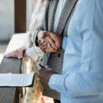 A business owner signing a contract