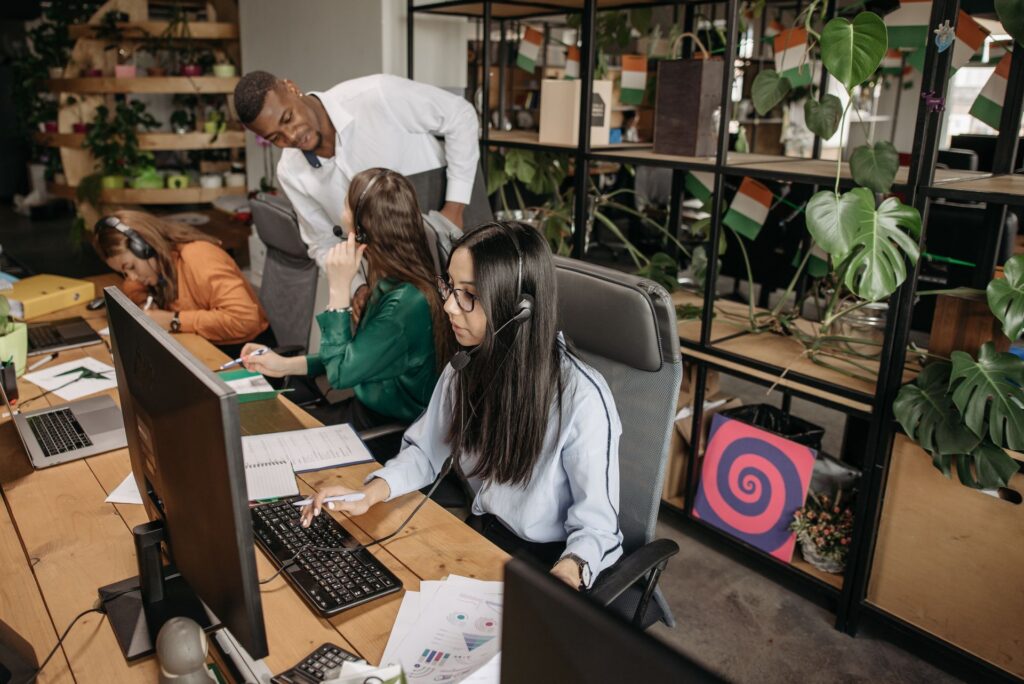 A large office team working at screens