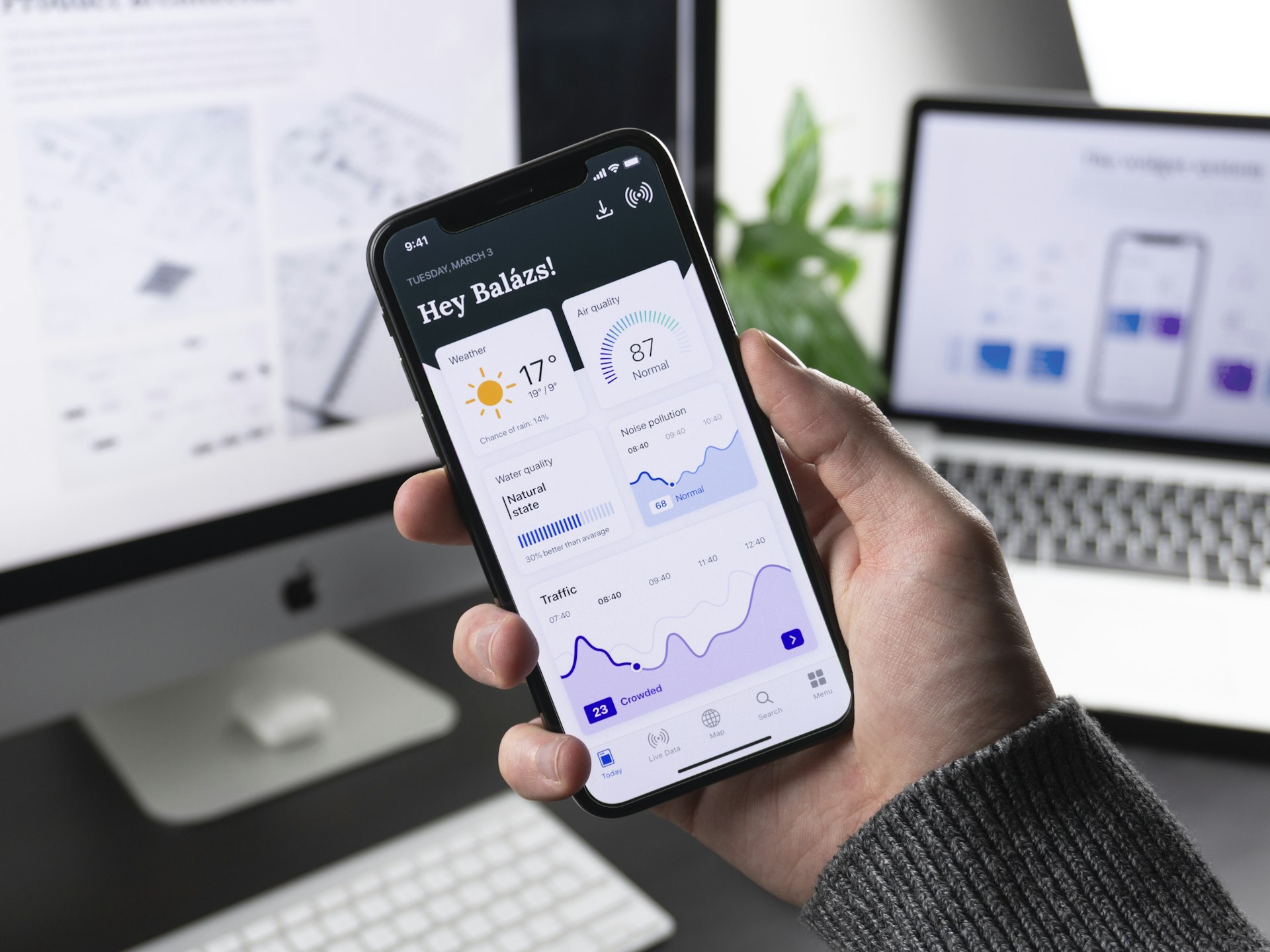 A publisher checking ad revenue on a phone