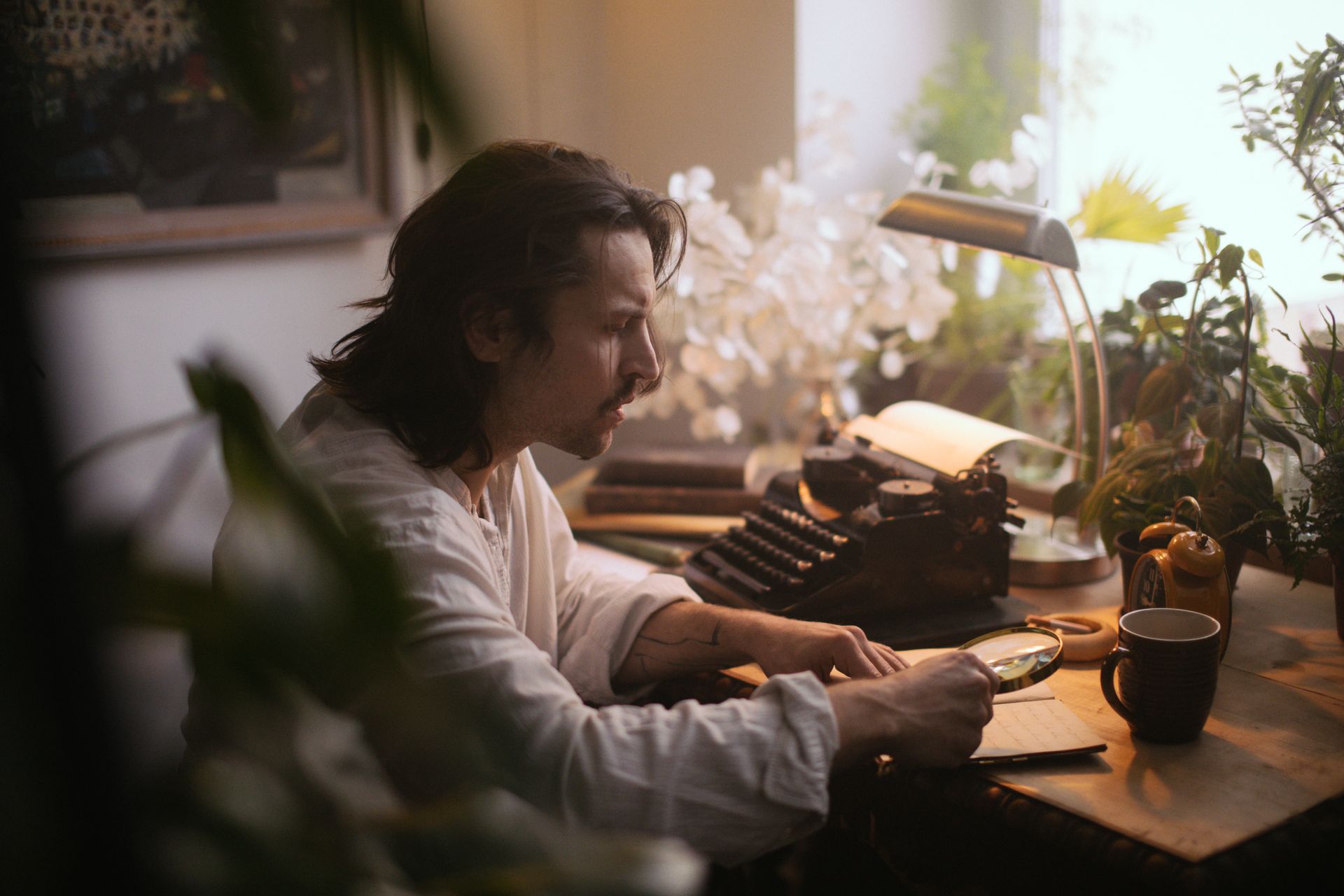 A writer at a desk with coffee