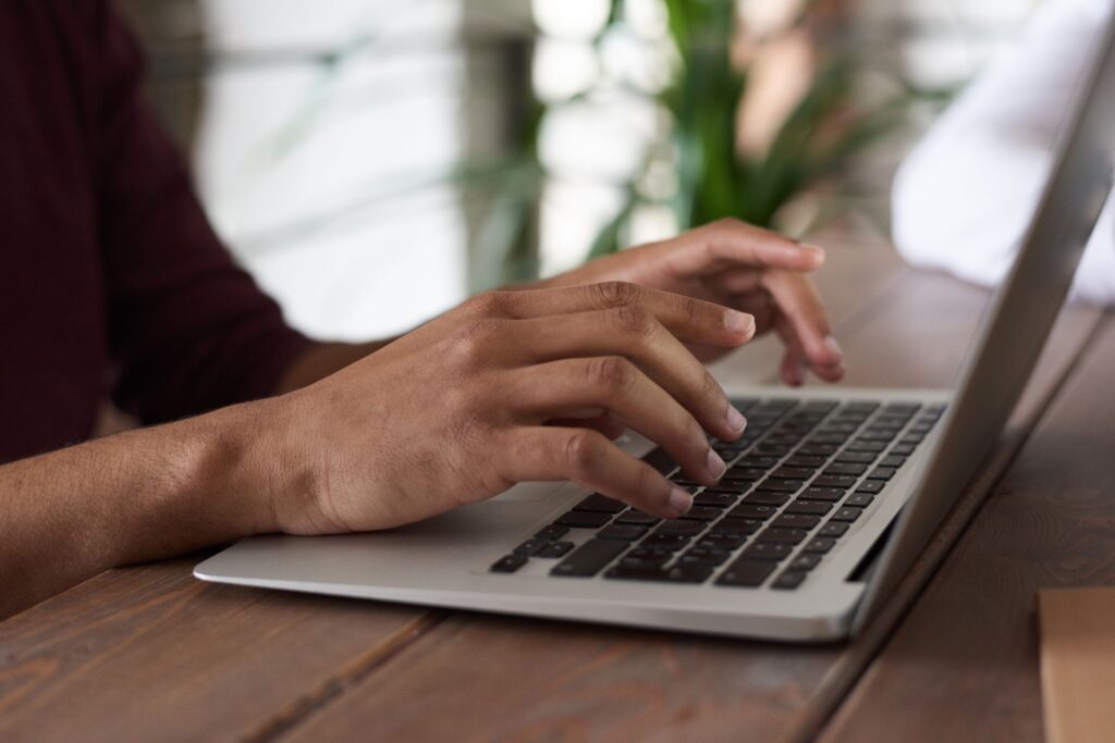 A writer publishing on a laptop