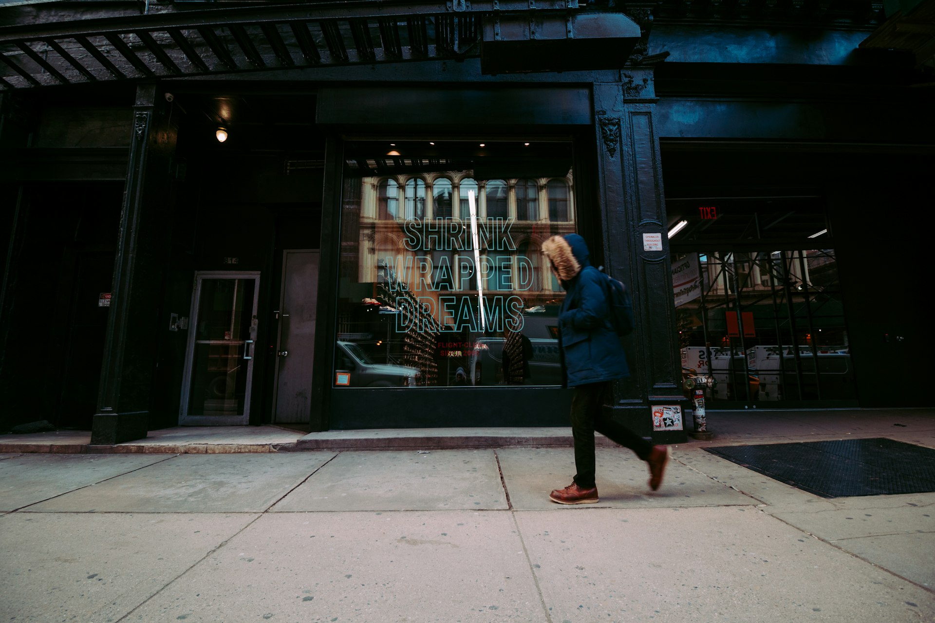 A photographer shooting a storefront