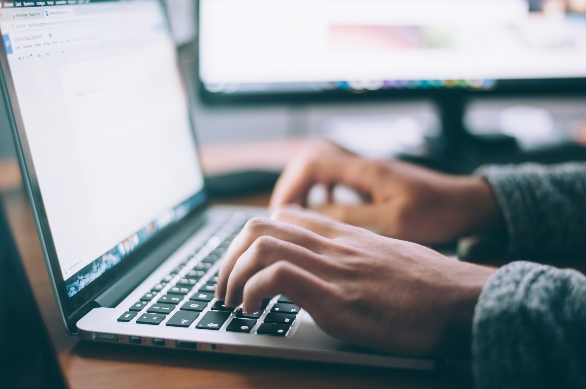 An owner replying on a laptop