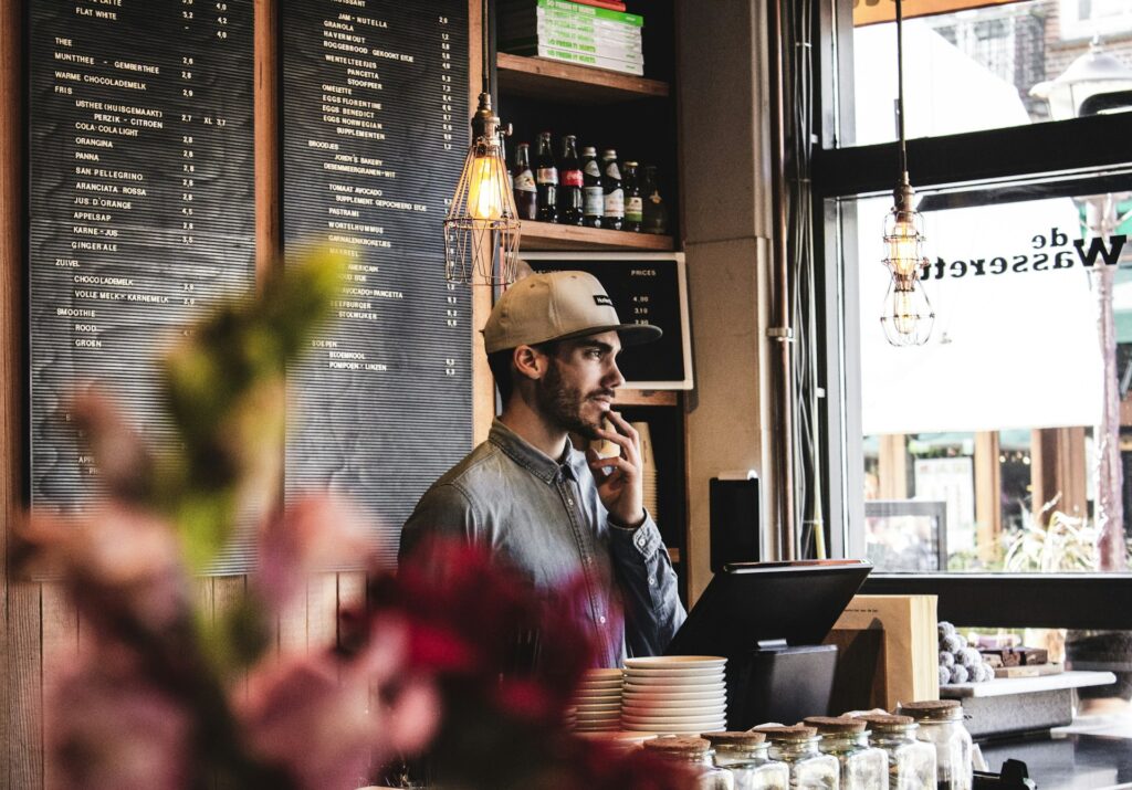 A small business owner at a shop counter