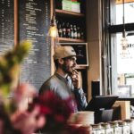 A small business owner at a shop counter
