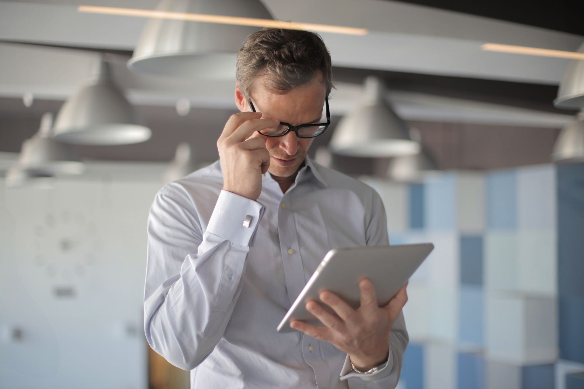 A person reading on a tablet
