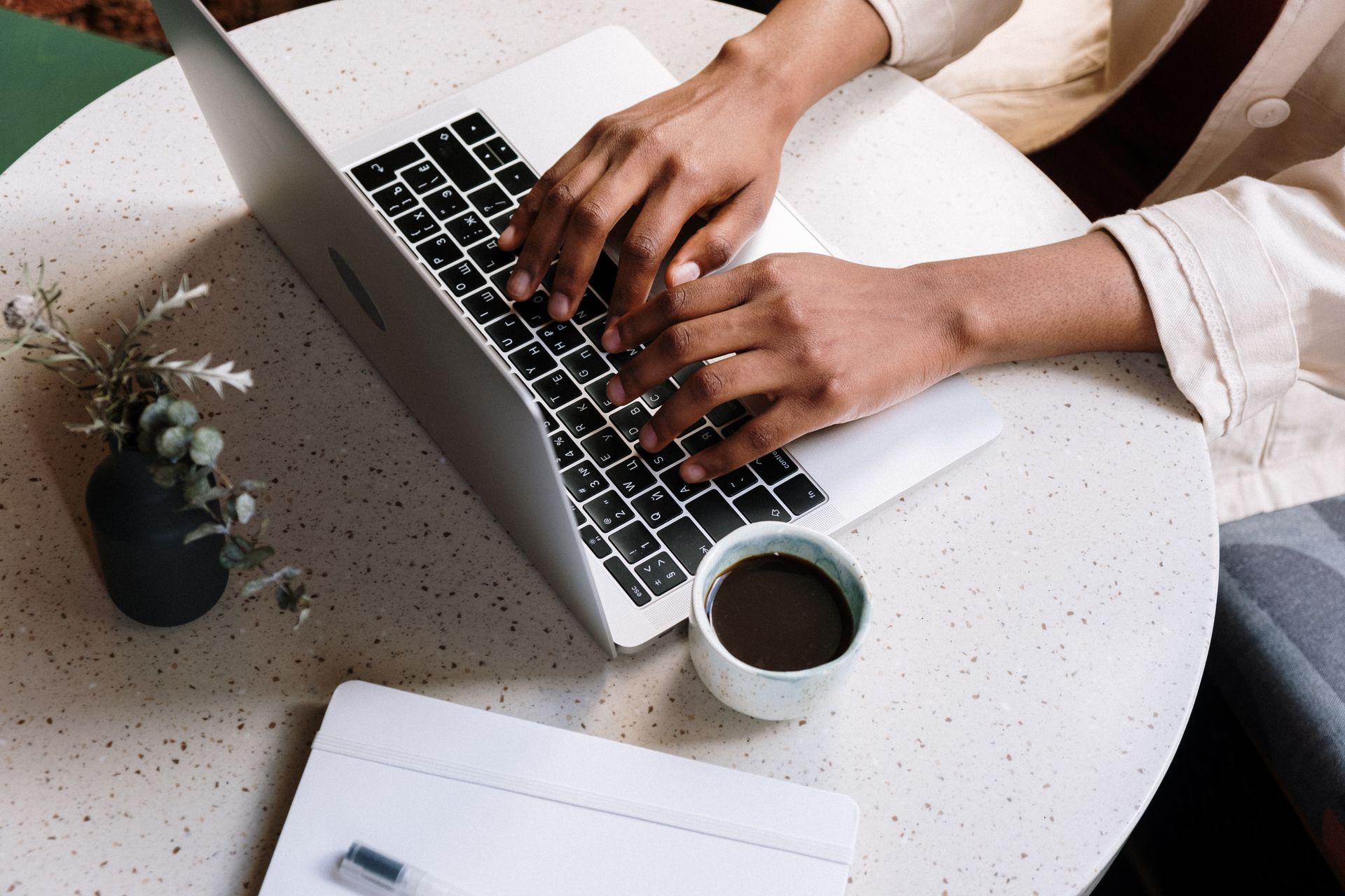A blogger writing on a laptop